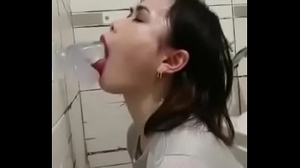 Asian deepthroating a dildo